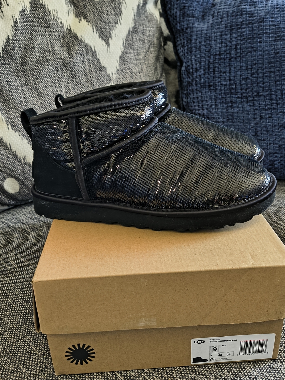 These are UGG Women's Classic Ultra Mini Mirror Ball boots in black. 